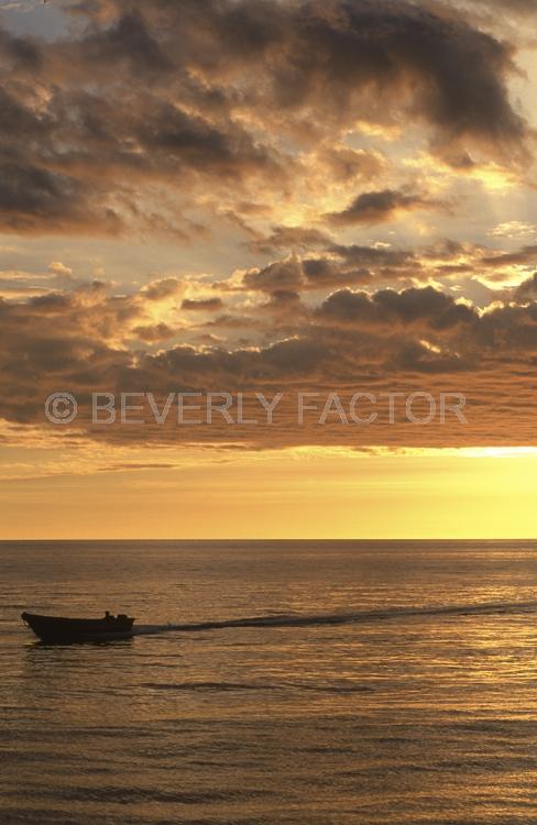 Island Sunsets;Papua New Guinea;sky;sillouettes;sunset;water;red;colorful;yellow;ocean;boats